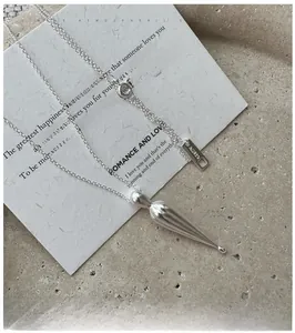 Detailed macro view of S925 sterling silver drop pendant and AG925 hallmark tag