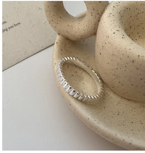 Close-up of S925 sterling silver ring with vertical grooves and S925 hallmark
