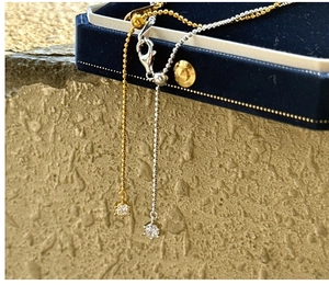 Detail of adjustable S925 silver bead chains with round cubic zirconia in gold and silver