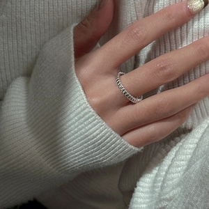 Minimalist S925 sterling silver vertical textured ring worn on hand with knit background
