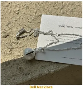 Detailed view of S925 sterling silver ball necklace with hammered texture finish