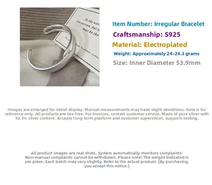 Detail of S925 sterling silver open bangle with brushed texture and minimalist design