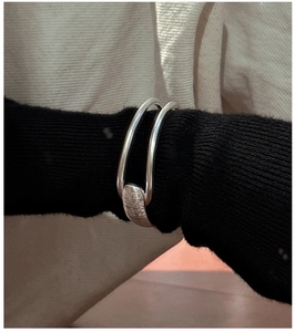 Close-up of S925 sterling silver double-band cuff bracelet with brushed texture