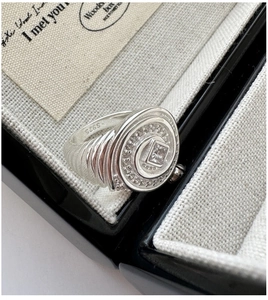 Macro shot of S925 sterling silver ring featuring square zircon and vintage textured band