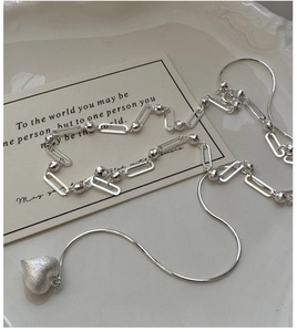 Detail of S925 sterling silver heart pendant necklace with elegant matte texture