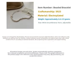 Detailed view of S925 sterling silver beaded bracelet with elegant white pearls and elastic cord