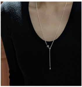 Detailed view of adjustable S925 silver Chopin necklace with sliding clasp and ball charm