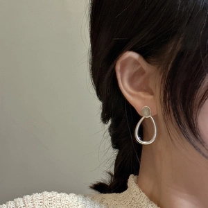 Elegant S925 sterling silver teardrop earrings on model with labradorite minimalist design