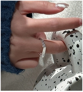 Macro detail of S925 sterling silver beaded ring with polished rectangular metal plate