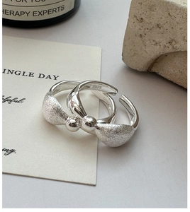 Close-up of S925 sterling silver stamp on brushed texture minimalist open ring