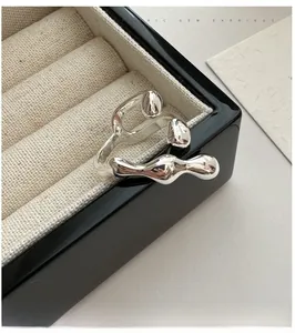 Detail view of silver S925 sterling silver ring with molten lava texture in jewelry box