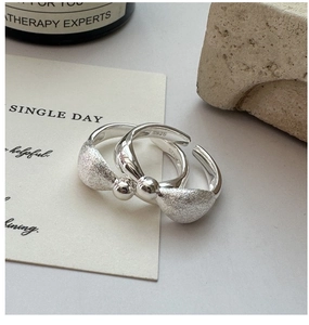 Close-up of S925 sterling silver ring featuring unique brushed and polished bead textures