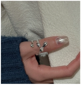 Detail of an S925 silver irregular fluid open ring on model with artistic liquid metal design