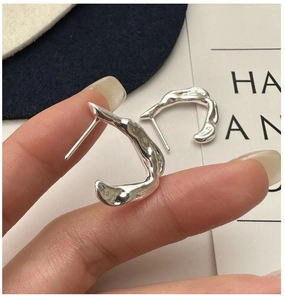 Detailed view of S925 silver irregular liquid-style earrings with high polish finish