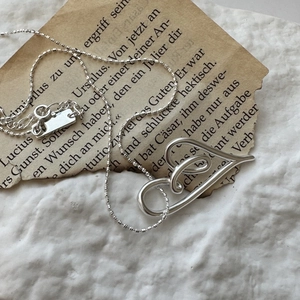 Vintage S925 sterling silver knotted heart necklace with a sleek ball chain for women
