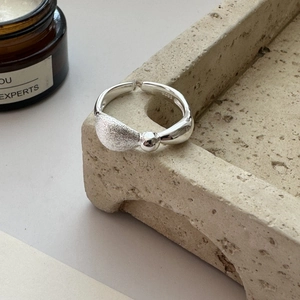 S925 sterling silver open ring with textured matte finish and polished bead accent