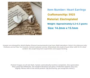 Detailed view of matte S925 sterling silver hollow heart earrings with 15.1mm dimensions