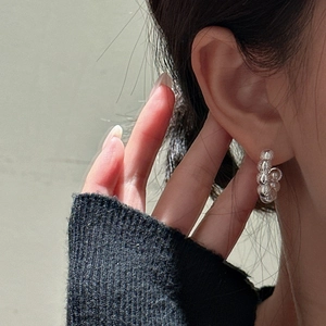 Minimalist S925 sterling silver beaded hoop earring shown on a model's earlobe