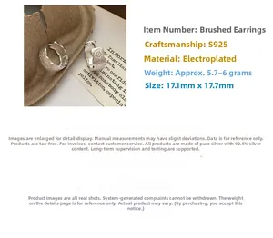 Detail view of S925 sterling silver hoop earrings with a brushed floral texture finish