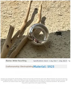 Detailed macro view of S925 sterling silver chunky dome ring on natural sandy texture