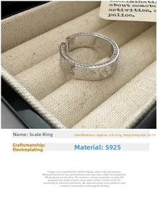 Detail of S925 sterling silver ring featuring a unique scale texture and hammered finish