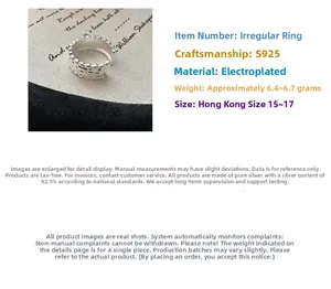 Detailed macro view of S925 sterling silver ring with handmade hammered texture surface