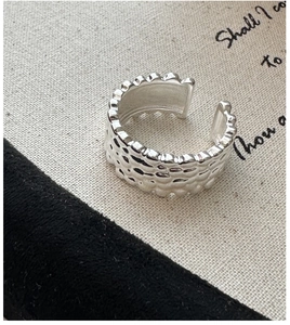 Close-up of S925 sterling silver ring featuring a unique hammered texture and vintage finish
