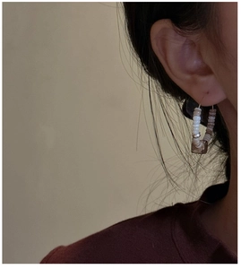 Detailed close-up of S925 sterling silver hoop earrings featuring natural multi-colored beads