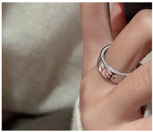 Detail of S925 silver ring featuring CNC engraved snowflake and pave set crystals
