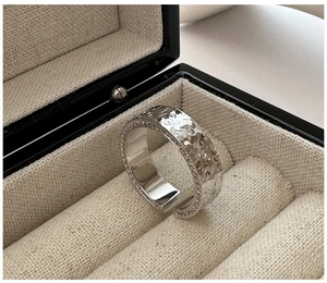 Detailed view of S925 silver ring with hammered texture and pave-set micro crystals