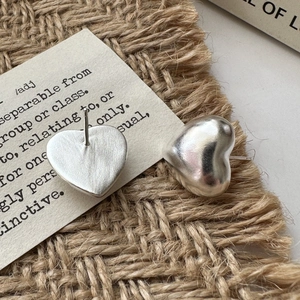 Brushed S925 sterling silver hollow heart stud earrings shown from front and back views