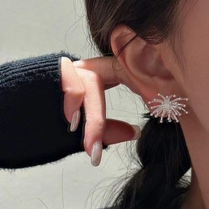 Minimalist S925 sterling silver firework stud earrings worn by a model in a side view