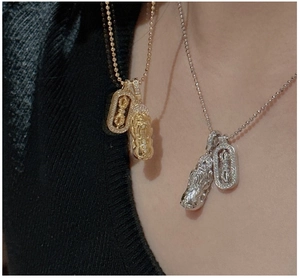 Close-up of S925 silver Vajra and Pixiu pendants with zircon accents on beaded chains