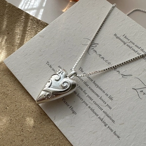 Vintage S925 sterling silver hollow heart necklace with engraved scrollwork patterns