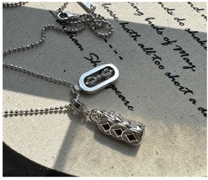 Detailed shot of S925 sterling silver necklace featuring Vajra and Pi Xiu pendants