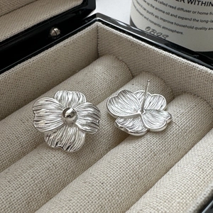 S925 sterling silver floral stud earrings with brushed metal finish in jewelry box