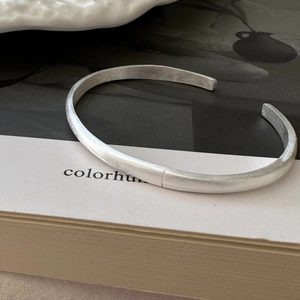 Minimalist S925 sterling silver open bangle with a brushed matte finish and thick metal band