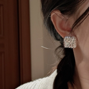 Elegant S925 sterling silver square earrings with woven texture on a female model
