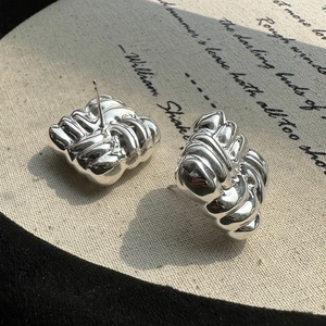 S925 sterling silver hollow knot earrings with liquid metal texture on vintage book paper