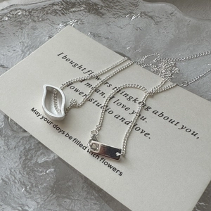 Minimalist S925 sterling silver leaf pendant necklace with rectangular tag on white card