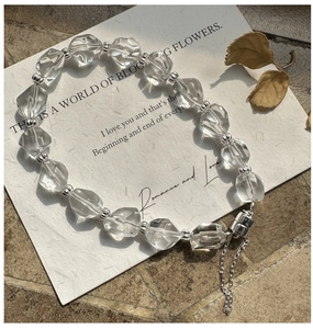 Detail of silver beaded bracelet with clear faceted crystals and magnetic clasp