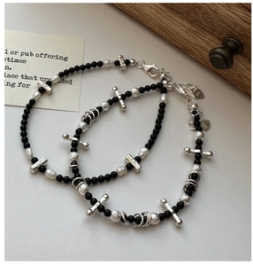 Detail of S925 silver retro cross bracelet with black beads and baroque pearls