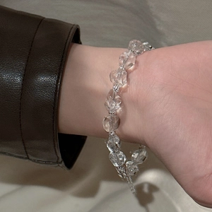 Minimalist S925 sterling silver bracelet with faceted crystal beads on model's wrist