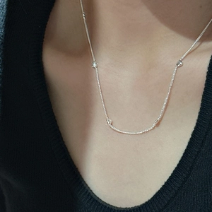 Minimalist S925 sterling silver heart necklace with multiple charms on a thin silver chain
