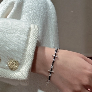 Elegant S925 silver beaded bracelet with black stones and a micro-pave cross charm
