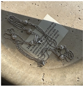 Detail shot of S925 sterling silver triple-layer beaded necklace with S925 hallmark
