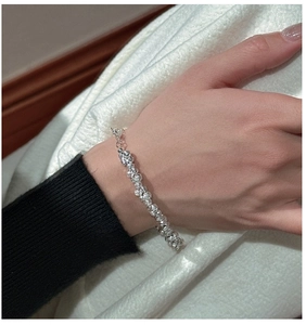 Close-up of S925 sterling silver beaded bracelet with shimmering faceted metal beads