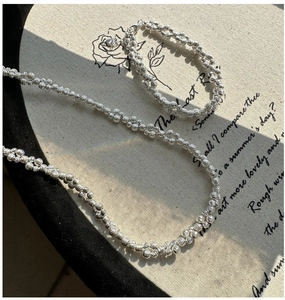 Macro detail of S925 sterling silver beaded bracelet showing the hallmark engraving