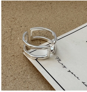 Detail of S925 sterling silver double-layered open ring with a sparkling clear zircon stone