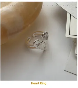 Macro view of S925 sterling silver heart ring with handcrafted hammered texture finish